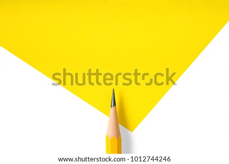 Minimalist template with copy space by top view close up macro photo of wooden yellow pencil isolated on white texture paper and combine with yellow shape. Flash light made smooth shadow from pencil.