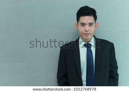 Portrait of asian handsome businessman,thailand people wearing suit,Smart guy act for take a photo