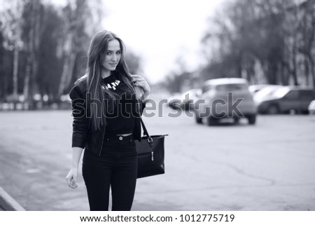 Toned picture of a young cute girl on a walk in the city
