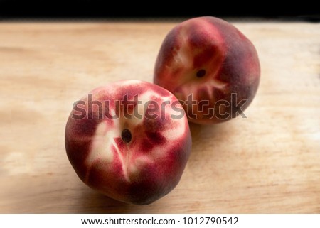 Peach or Nectarine, one of symbolic Chinese New Year Fruit representing long life and health as immortality, closeup and selective focus.