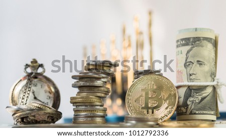 Golden Bitcoin On Top Of Pile Of US Dollar Banknote and Vintage Clock, Use As Business And Finance Concept. 