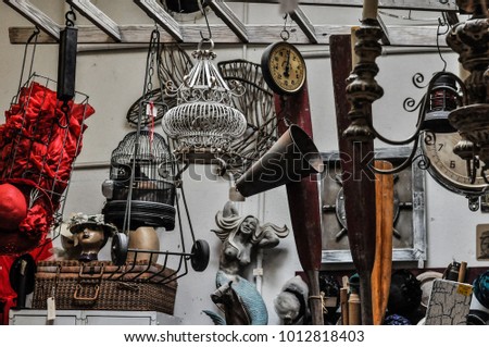 Random objects and decorations in a thrift store Royalty-Free Stock Photo #1012818403