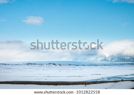 Beautiful view and winter Landscape picture with  Snow field and lake with bluesky in Iceland.