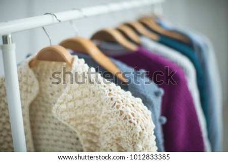 Clothes on a hanger, sweater 
