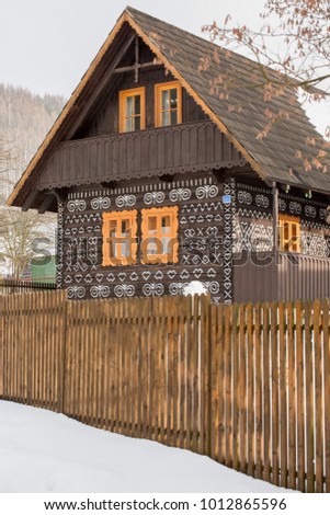 Cicmany, Slovakia. Old wooden houses in Slovakia village Cicmany in winter. The ornaments from Cicmany, and the Slovak folk pattern. The village of Cicmany is on the list of UNESCO. 