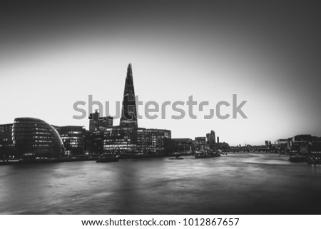 Black and white view of London Bridge and the river Thames from the perspective of Tower Bridge
