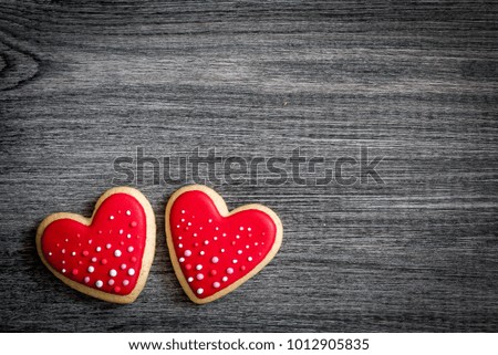Gingerbread heart cookies on a rustic wooden background. Valentine's Day concept. Free space copyspace for your text
