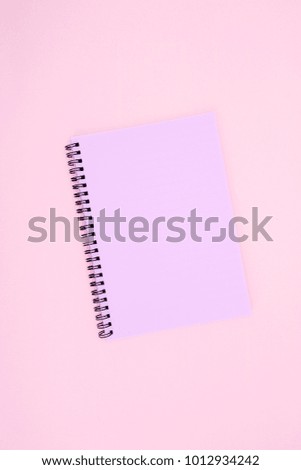 A studio photo of a notebook pad