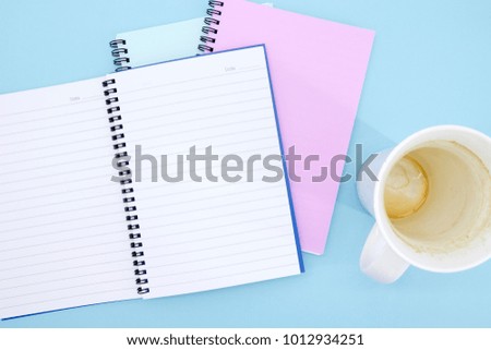 A studio photo of a notebook pad