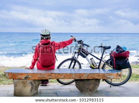 
Woman bicyclist cycle around the island in Taiwan, ride cyclist stylized picture, road cycling, cycling tour, cycling track, bicycle

