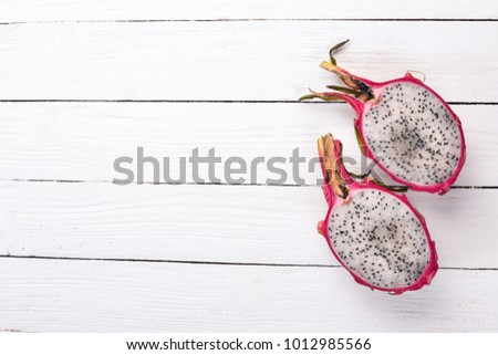 Dragon Fruit. Tropical Fruits. On a wooden background. Top view. Copy space.