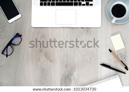 Top view of office desk table with modern laptop and accessories objects on wooden. Business, education concepts ideas/flat lay design Royalty-Free Stock Photo #1013034730