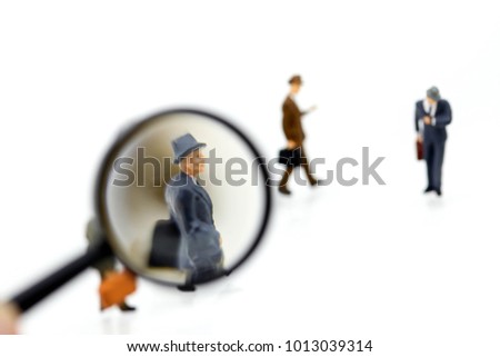 Miniature people :  business look for employees for job placement, using as background Choice of the best  employee, HR, HRM, HRD, job recruiter concepts.