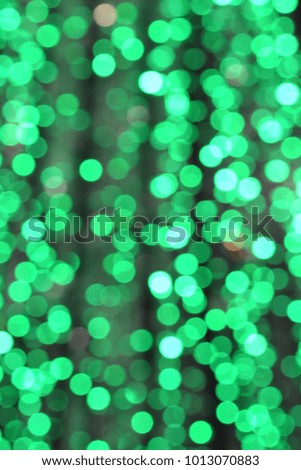 Green circular bokeh, light at night, flashing light.