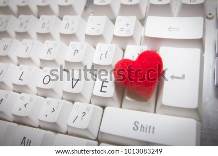 Red Heart,feather Words is LOVE On keyboard Symbol of valentine Day