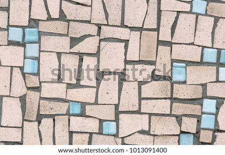 pattern of the wall made from broken tile