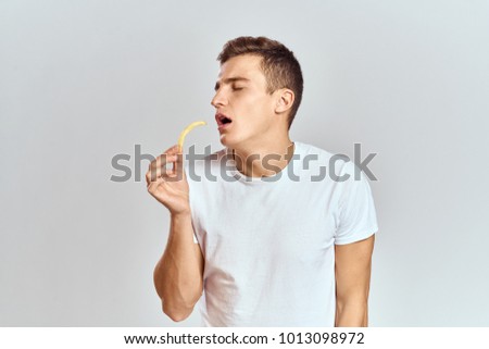   man with potatoes on a light background                             