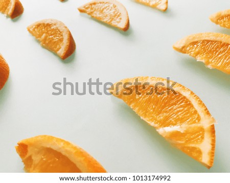 Creative fruit pattern made of sliced orange. Food background.