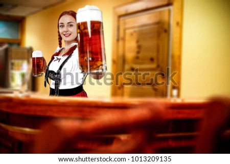 Young slim bavarian woman and her own small business. Hotel interior. 