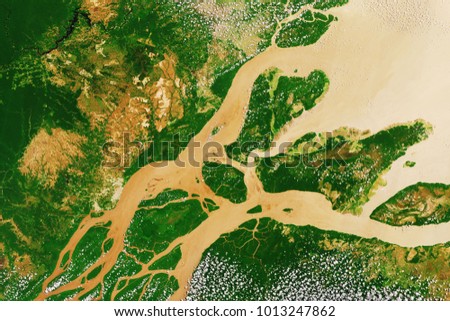 River delta of the Amazon, the largest river in the world, seen from space - Modified elements of this image furnished by ESA  Royalty-Free Stock Photo #1013247862
