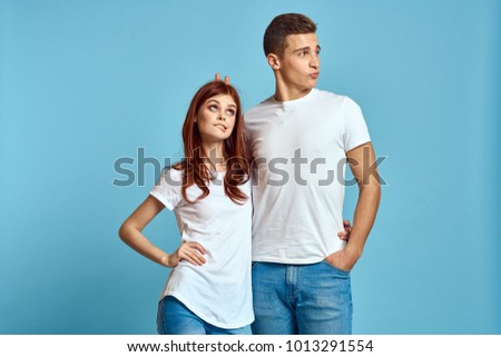  young couple in white t-shirts                              