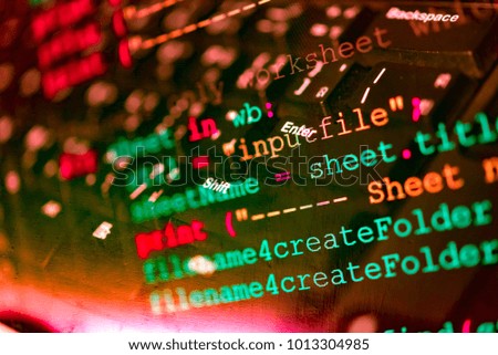 Software code development as concept. Double exposure of programming code screen and computer for software developing.
