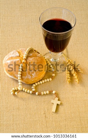 First Holy Communion composition on beige sackcloth background.