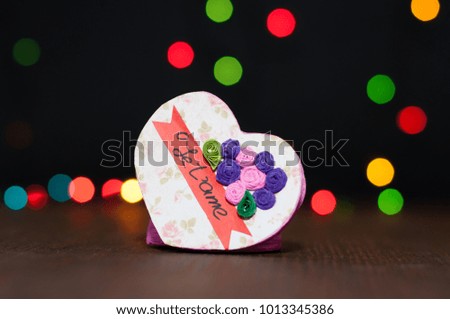 Handmade jewelery for St. Valentine's Day a cardboard heart magnet