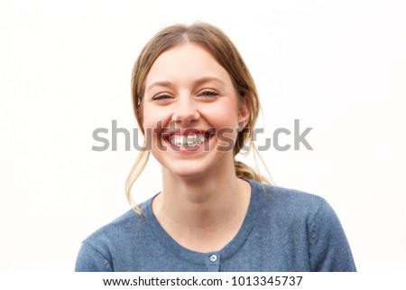 Close up portrait of happy young woman smiling against white background