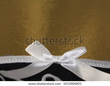 Festive golden and white ribbon bow celebrate empty background template 