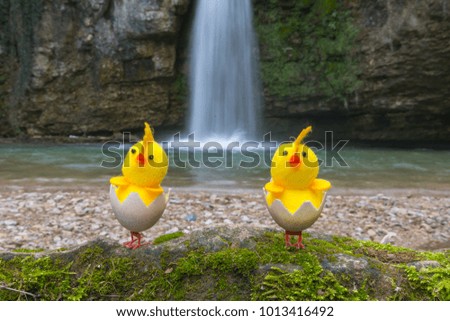 Waterfall with birds on eastern- Easter background