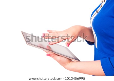 Woman holding a tablet pc, isolated on a white background. The concept of using the Internet, gadgets, search.