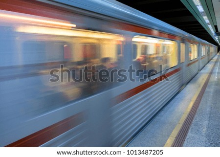 Moving subway train at metro station 