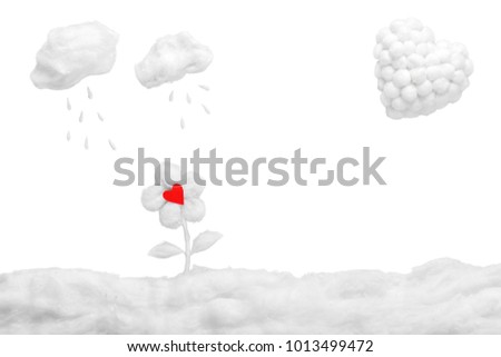 Two small clouds pouring rain over two mushrooms and a white heart, in a heavenly scenery where the clouds  are made from cotton-wool, on a blue sky paper background.