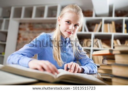 Teenage girl in a library