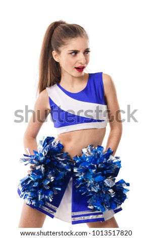 Young cheerleader in blue and white suit with pompoms on white background. Isolated on white background.