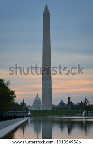 Washington DC, National Mall sunrise scene including World War II Memorial, the Monument and Capitol Building