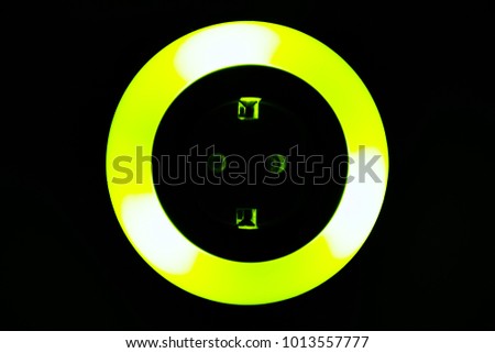 Lamp night light in a dark background. Vintage effect style picture. colorful night light. ring lamp. Neon light circle. the light takes the shape of a circle