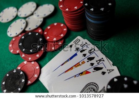 Poker Hands / Royal Flush 3. Five playing cards - the poker royal flush hand. Royal Flash, card deck, poker royal flash on cards and poker chips on green casino table. success in gambling. soft focus