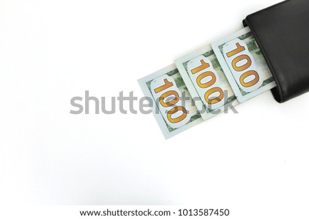 dollars in a purse on a white background