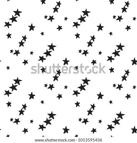 Black small little stars seamless pattern. Sketch doodle star illustration on white background in hand drawn hipster style.