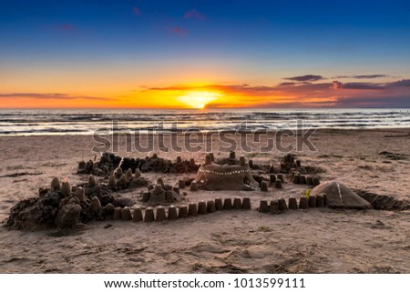 A nice sandcastle at sunset with a deep blue sky at Mellbystrand.