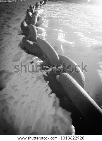 Anchor chain in the low light of winter. Royalty-Free Stock Photo #1013622928