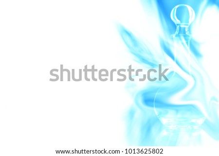 Empty glass decanter on white background enveloped in puff of blue smoke. Place for your text.
