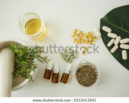 alternative herb medicine. herbal vitamin on white background.