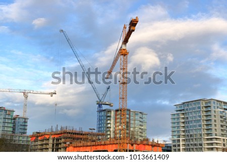 Construction cranes and development dominates the Vancouver, Canada skyline. 