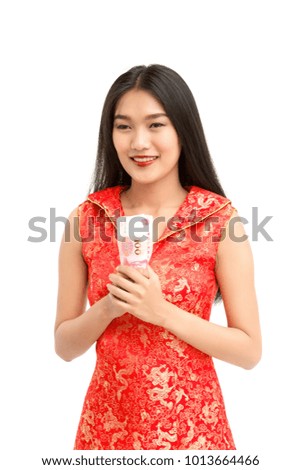 young asian woman in red chinese dress hold yuan money for power shopping concept