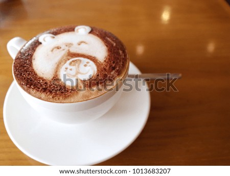 soft focus top view  white cup of cappuccino coffee on wood background. 