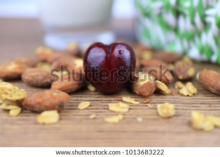 Fresh Red Cherry Look like  Heart on table .And Almond ,Egg,Milk backgound.