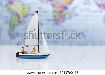Miniature people: Tourists with sports sailing. Image use for travel business concept.